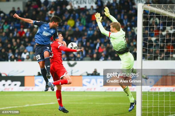 Marco Terrazzino of Hoffenheim scores his team's second goal past Fabian Frei and goalkeeper Jonas Loessl of Mainz during the Bundesliga match...