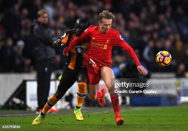 Michael Dawson of Hull City and Lucas Leiva of Liverpool battle for possession during the Premier League match between Hull City and Liverpool at...