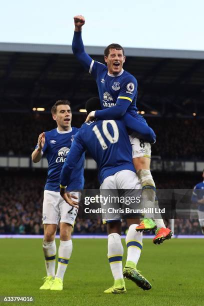 Romelu Lukaku of Everton celebrates scoring his side's fifth goal with team-mate Ross Barkley during the Premier League match between Everton and AFC...