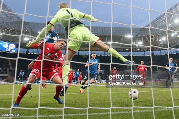 Marco Terrazzino of Hoffenheim scores his team's second goal past Fabian Frei and goalkeeper Jonas Loessl of Mainz during the Bundesliga match...
