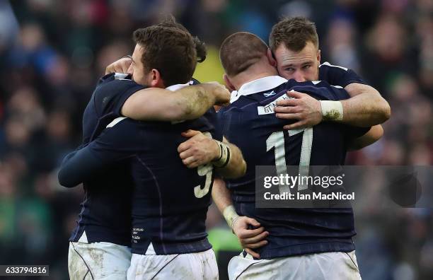 Team mates congratulate Greig Laidlaw of Scotland at full time during the RBS 6 Nations match between Scotland and Ireland at Murrayfield Stadium on...