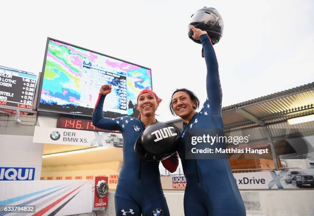 Elana Meyers Taylor and Lolo Jones of the United States celebrate after the Women's Bobsleight final run of the BMW IBSF World Cup at Olympiabobbahn...