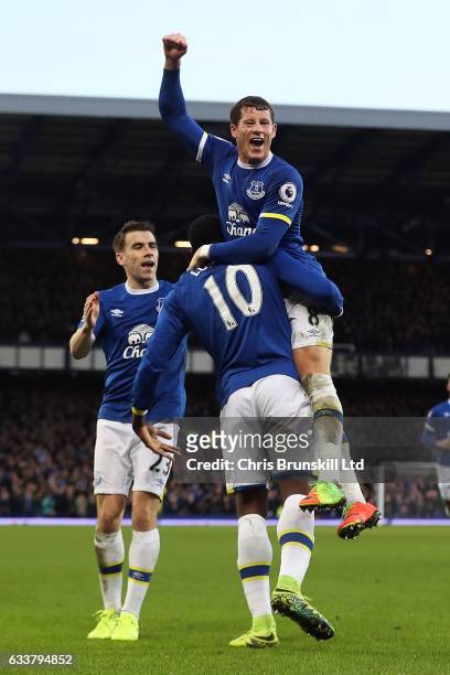 Romelu Lukaku of Everton celebrates scoring his side's fifth goal with team-mate Ross Barkley during the Premier League match between Everton and AFC...
