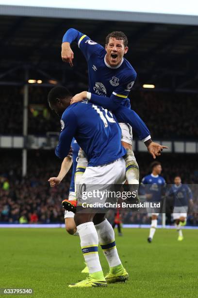 Romelu Lukaku of Everton celebrates scoring his side's fifth goal with team-mate Ross Barkley during the Premier League match between Everton and AFC...