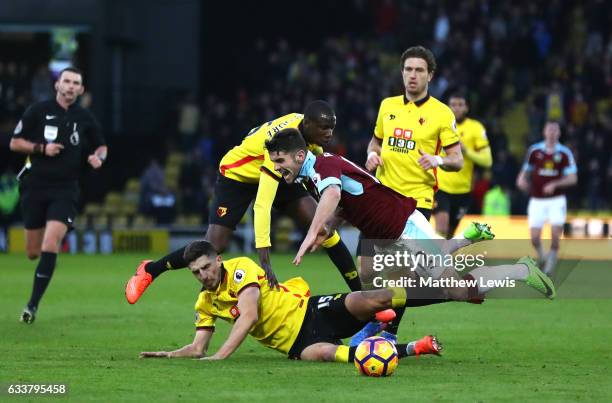 Craig Cathcart of Watford tackles Robbie Brady of Burnley during the Premier League match between Watford and Burnley at Vicarage Road on February 4,...