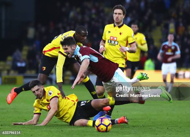 Craig Cathcart of Watford tackles Robbie Brady of Burnley during the Premier League match between Watford and Burnley at Vicarage Road on February 4,...