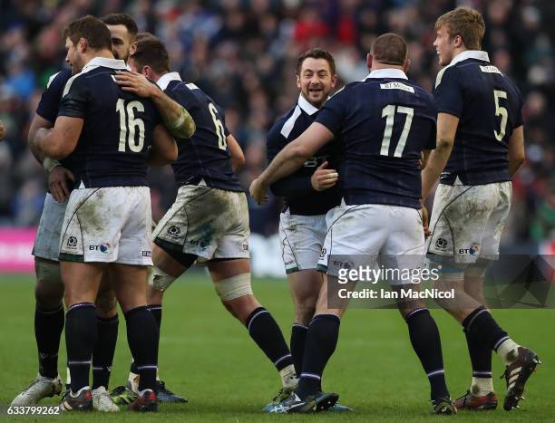 Team mates congratulate Greig Laidlaw of Scotland at full time during the RBS 6 Nations match between Scotland and Ireland at Murrayfield Stadium on...