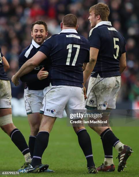 Team mates congratulate Greig Laidlaw of Scotland at full time during the RBS 6 Nations match between Scotland and Ireland at Murrayfield Stadium on...