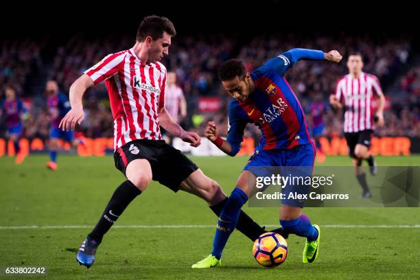 Neymar Santos Jr of FC Barcelona dribbles Aymeric Laporte of Athletic Club during the La Liga match between FC Barcelona and Athletic Club at Camp...