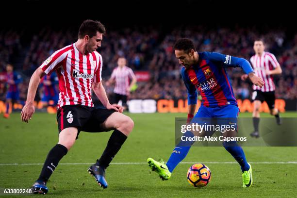 Neymar Santos Jr of FC Barcelona dribbles Aymeric Laporte of Athletic Club during the La Liga match between FC Barcelona and Athletic Club at Camp...