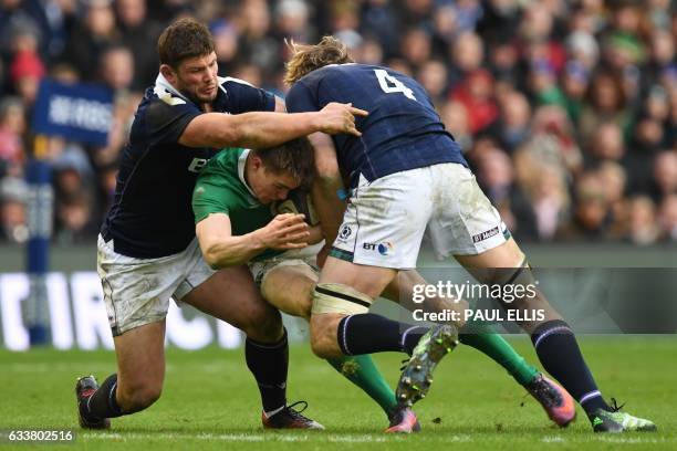 Ireland's centre Garry Ringrose is tackled by Scotland's lock Richie Gray during the Six Nations international rugby union match between Scotland and...