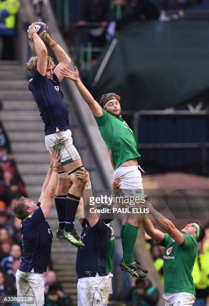 Scotland's lock Richie Gray catches a line out ball by Ireland's lock Iain Henderson during the Six Nations international rugby union match between...