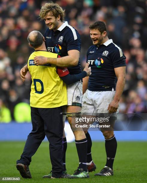 Scotland players Richie Gray and Ross Ford celebrate with Doctor Robson after the RBS Six Nations match between Scotland and Ireland at Murrayfield...