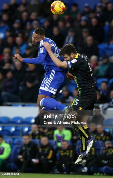 Kenneth Zohore of Cardiff City challenges Russell Martin of Norwich City during the Sky Bet Championship match between Cardiff City and Norwich City...