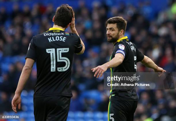 Russell Martin of Norwich City speaks to team mate Timm Klose during the Sky Bet Championship match between Cardiff City and Norwich City at Cardiff...