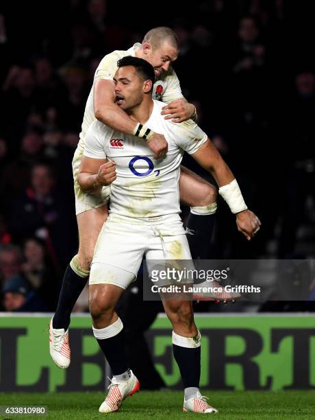 Ben Te'o of England celebrates scoring his side's first try with his team mate Mike Brown during the RBS Six Nations match between England and France...