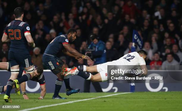 Ben Te'o of England dives over to score his team's first try during the RBS Six Nations match between England and France at Twickenham Stadium on...