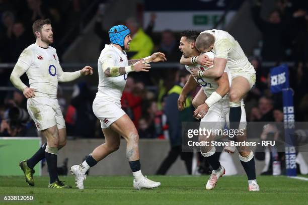 Ben Te'o of England celebrates with teammates Mike Brown, Jack Nowell and Elliot Daly after scoring his team's first try during the RBS Six Nations...