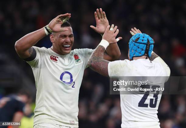 Nathan Hughes of England and Jack Nowell of England celebrate their team's victory after the final whistle blows during the RBS Six Nations match...