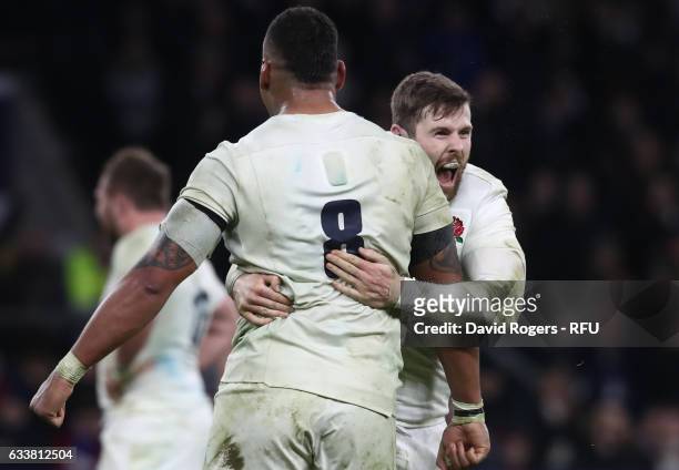 Nathan Hughes of England and Elliot Daly of England celebrate their team's victory after the final whistle blows during the RBS Six Nations match...
