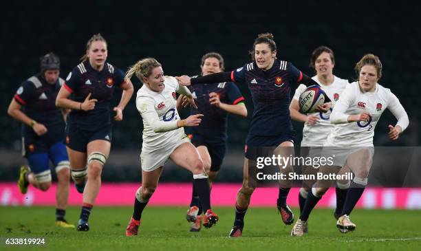 Caroline Ladagnous of France attempts to get away from the English defence during the Women's Six Nations match between England and France at...