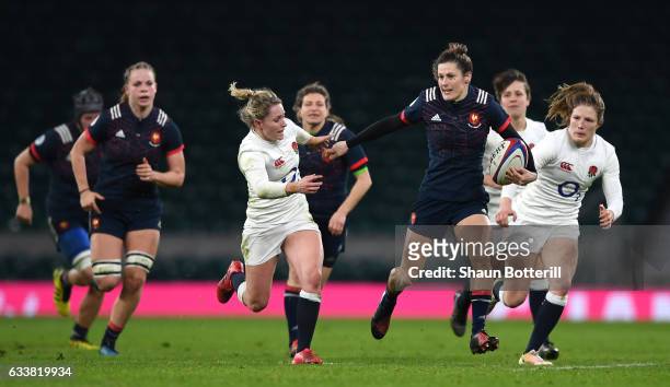 Caroline Ladagnous of France attempts to get away from the English defence during the Women's Six Nations match between England and France at...