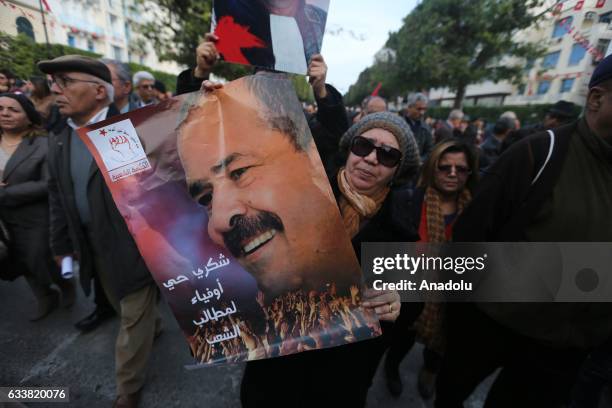 Tunisians gather during the death anniversary of the Chokri Belaid as they demand from Government to unveil the mystery of his death, in Tunis,...