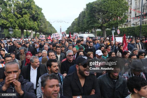 Tunisians gather during the death anniversary of the Chokri Belaid as they demand from Government to unveil the mystery of his death, in Tunis,...