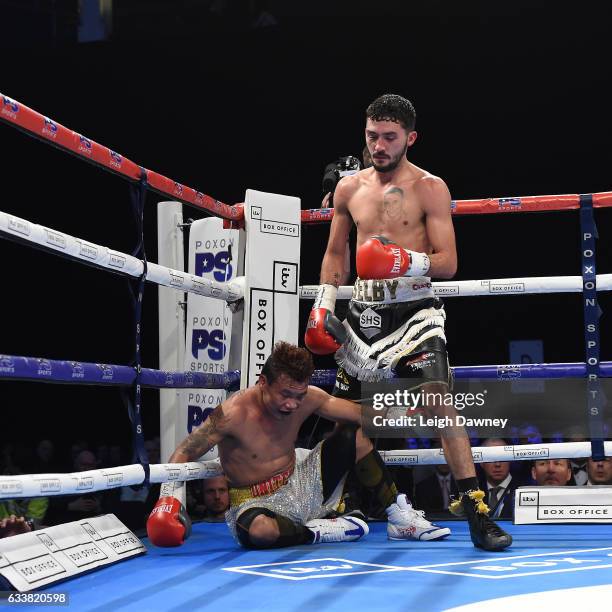 Ardin Diale of the Philippines slips in the corner whilst fighting Andrew Selby of Wales during their WBC International Flyweight title fight at...