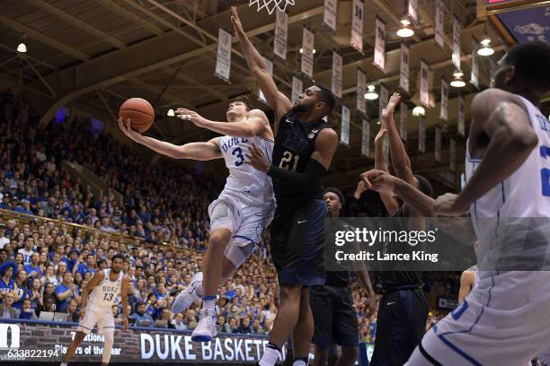 Grayson Allen of the Duke Blue Devils goes to the basket against Sheldon Jeter of the Pittsburgh Panthers at Cameron Indoor Stadium on February 4,...