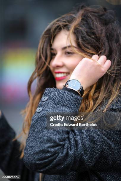 Insaf Bennis, fashion blogger from Sparkles in Paris, wears a Levi's gray wool coat, Apostrophe camel suit and pants, Mango black shoes, a black top,...