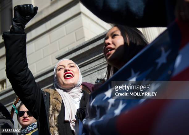 Zeina, who did not want to give her last name, takes part in a protest against President Donald Trump's recent action on refugees entering the U.S.,...