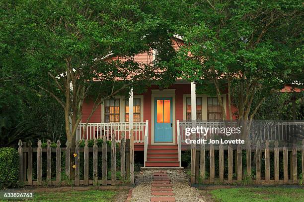 cottage facade at dusk - simple house exterior foto e immagini stock