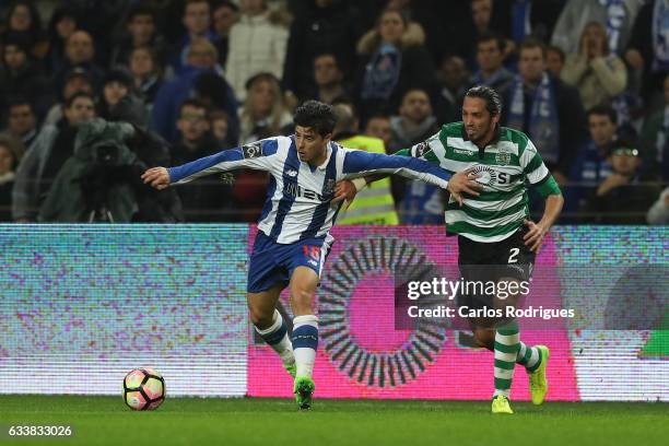 Porto's midfielder Joao Carlos Teixeira vies with Sporting CP's defender Ezequiel Schelotto from Argentina during the FC Porto v Sporting CP -...