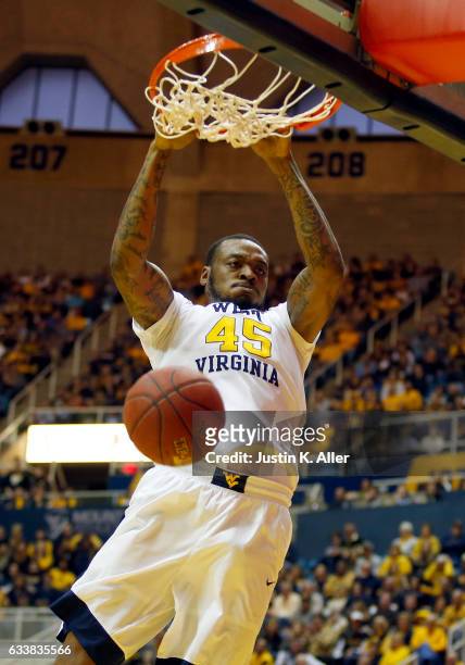 Elijah Macon of the West Virginia Mountaineers dunks the basketball against the Oklahoma State Cowboys at the WVU Coliseum on February 4, 2017 in...
