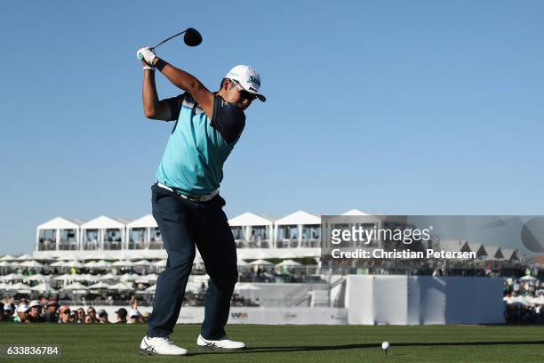 Hideki Matsuyama of Japan plays a tee shot on the 18th hole during the third round of the Waste Management Phoenix Open at TPC Scottsdale on February...