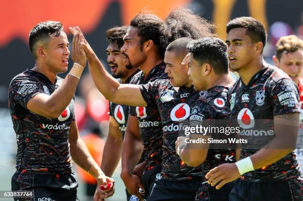 Warriors players celebrate a try during the 2017 Auckland Nines match between the New Zealand Warriors and the St George Illawarra Dragons at Eden...