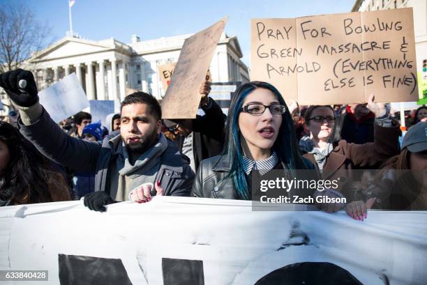 Demonstrators march from the White House to the Capitol Building on February 4, 2017 in Washington, DC. The demonstration was aimed at President...