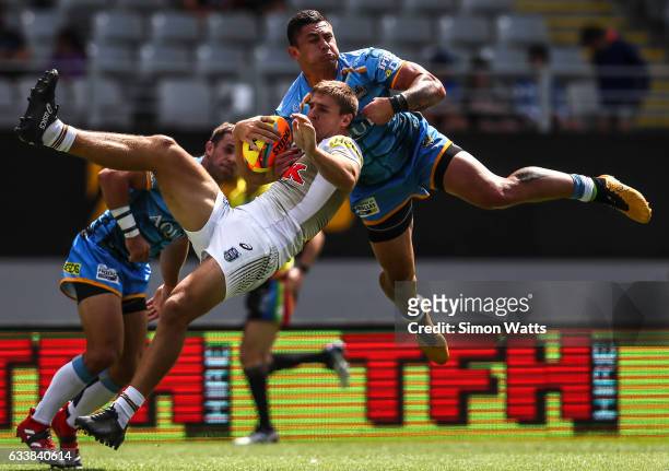 Daniel Vidot of the Titans and Jed Cartwright of the Panthers compete for a high ball during the 2017 Auckland Nines match between the Penrith...
