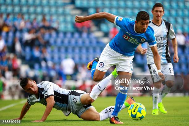 Angel Sepulveda of Queretaro struggles for the ball with Joao Rojas of Cruz Azul during the 5th round match between Cruz Azul and Queretaro as part...