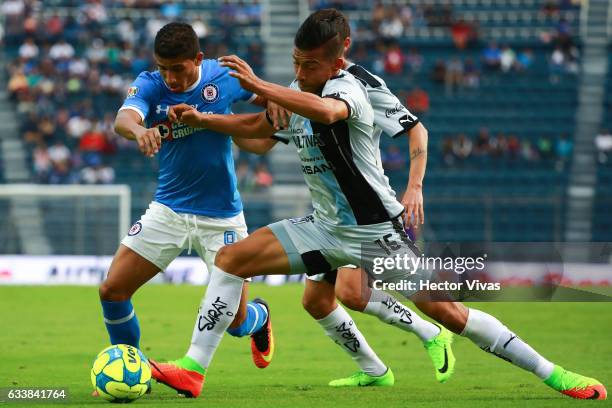 Angel Sepulveda of Queretaro struggles for the ball with Joao Rojas of Cruz Azul during the 5th round match between Cruz Azul and Queretaro as part...