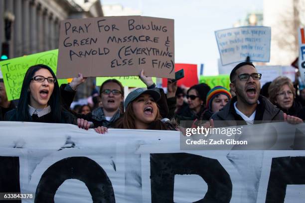 Demonstrators march from the White House to the Capitol Building on February 4, 2017 in Washington, DC. The demonstration was aimed at President...