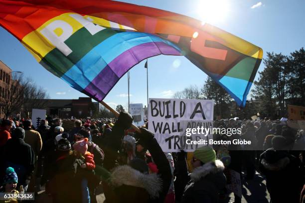 Lynda Tocci, of East Somerville, waves a flag while her partner Anne-Marie Fitzgerald holds a sign during a rally in support of the communitys 30...