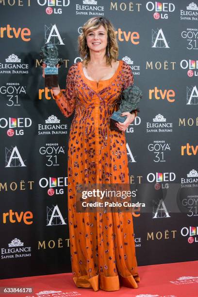 Actress Emma Suarez holds the award for the best actress in a leading role award for the film 'Julieta' during the 31st edition of the Goya Cinema...