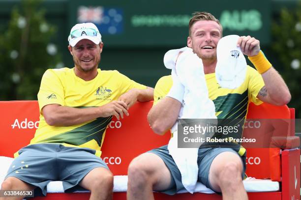 Lleyton Hewitt captain of Australia speaks with Sam Groth of Australia as he competes in his singles match against Jiri Vesely of Czech Republic...