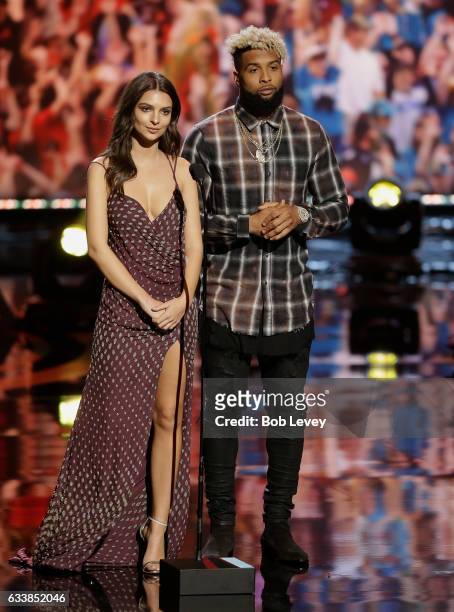 Emily Ratajkowski and Odell Beckham Jr. Of the New York Giants present the present the AP Offensive Rookie of the Year to quarterback Dak Prescott of...