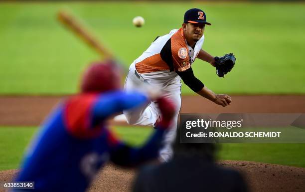 Pitcher Wilfredo Boscan of Aguilas del Zulia from Venezuela throws against Alazanes de Granma from Cuba during the Caribbean Baseball Series at...