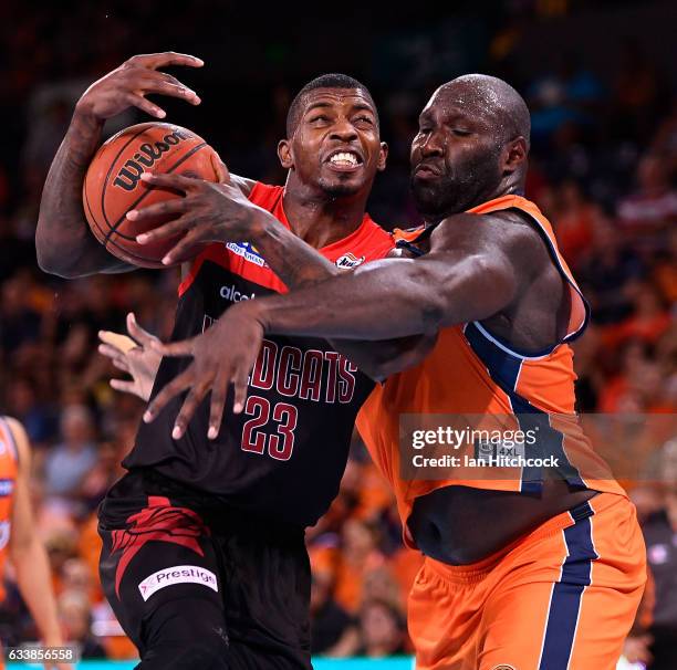 Casey Prather of the Wildcats drives to the basket past Nathan Jawai of the Taipans during the round 18 NBL match between the Cairns Taipans and the...