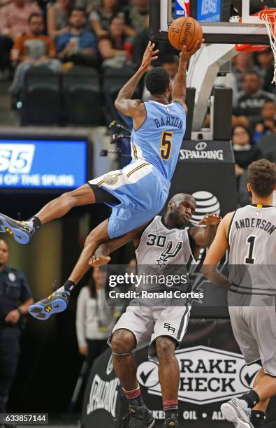 Joel Anthony of the San Antonio Spurs takes the charge from Will Barton of the Denver Nuggets at AT&T Center on November 5, 2016 in San Antonio,...