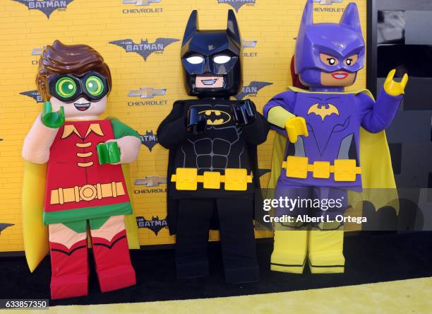 Robin, Batman and Batgirl arrive for the Premiere Of Warner Bros. Pictures' "The LEGO Batman Movie" held at Regency Village Theatre on February 4,...